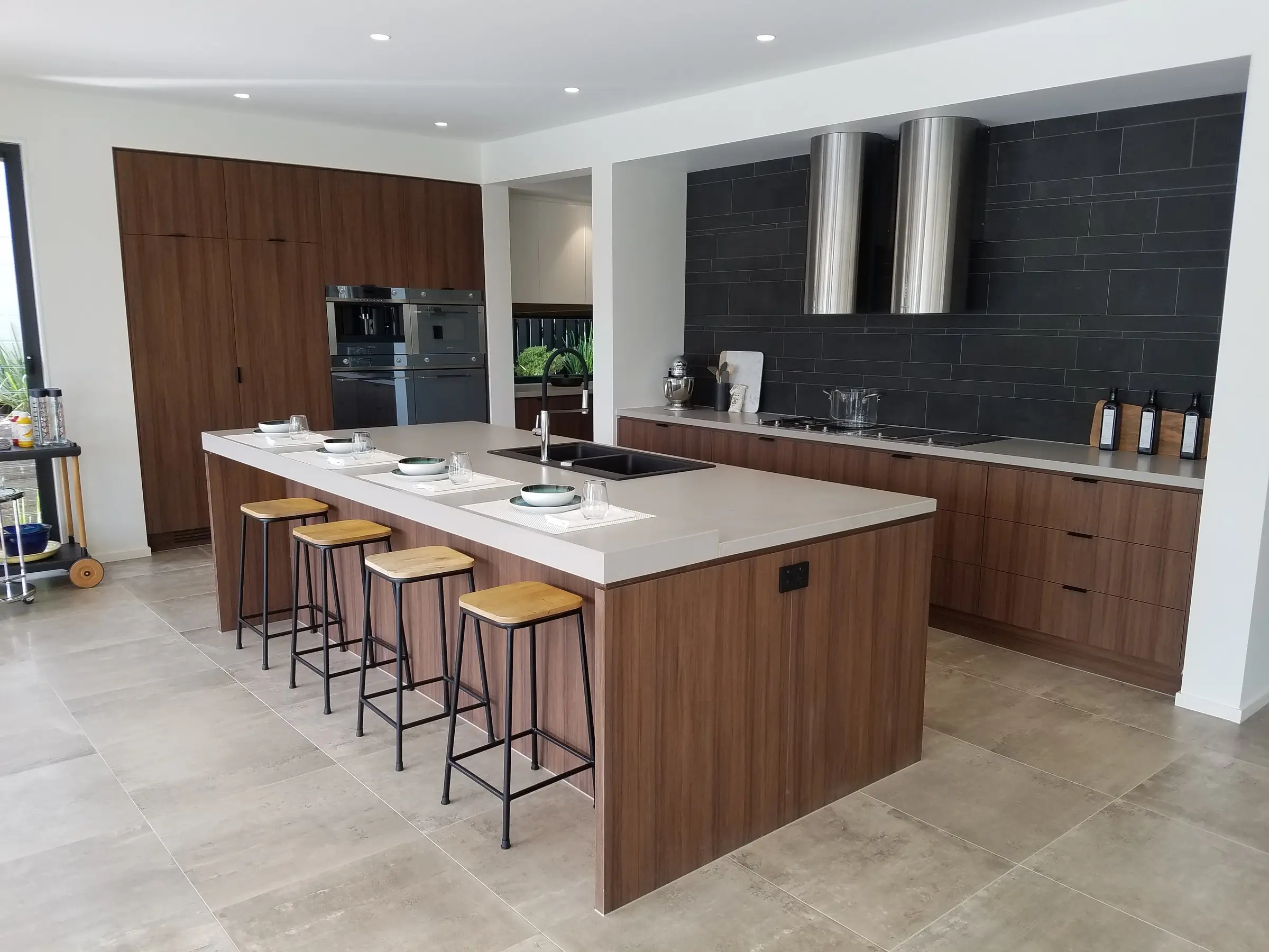 Finished kitchen with timber joinery and slate splashback, Finer Touch Projects