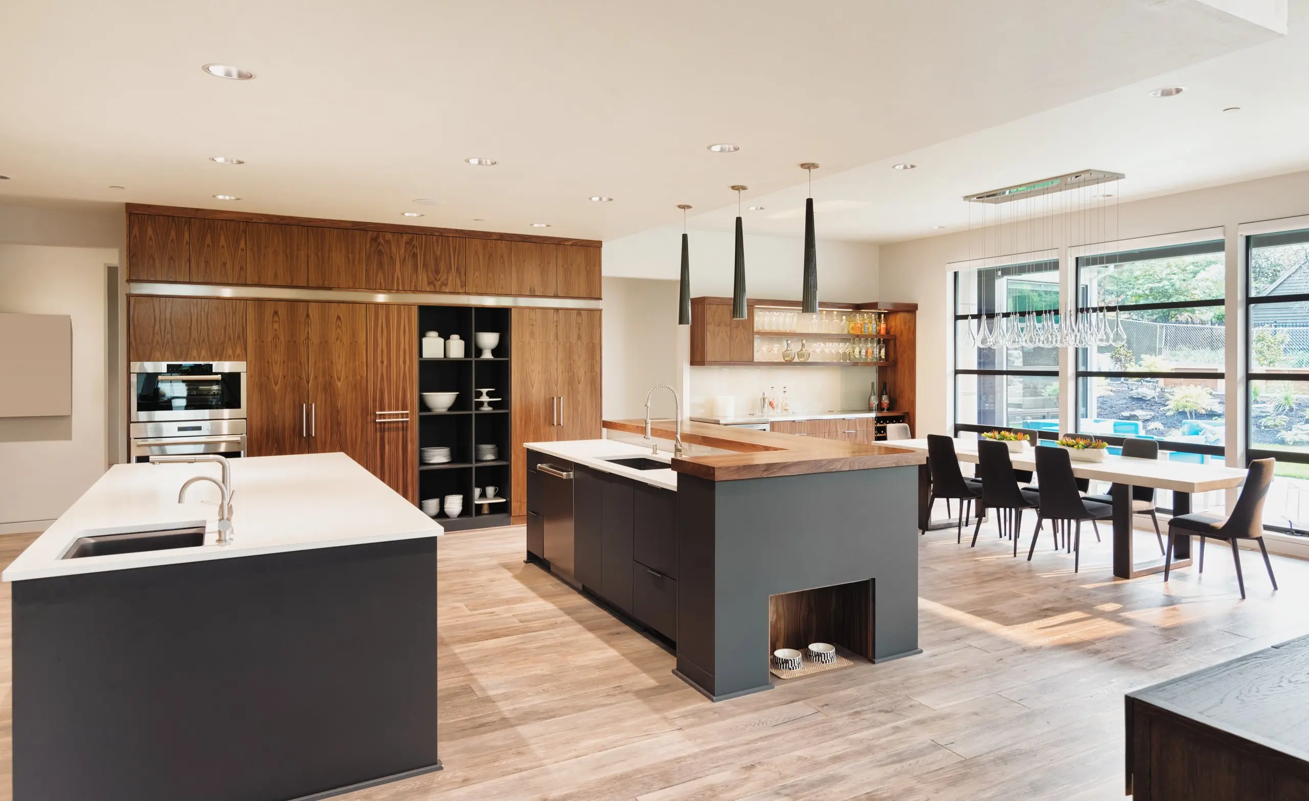 Finished open-plan kitchen and dining with timber joinery, Finer Touch Projects